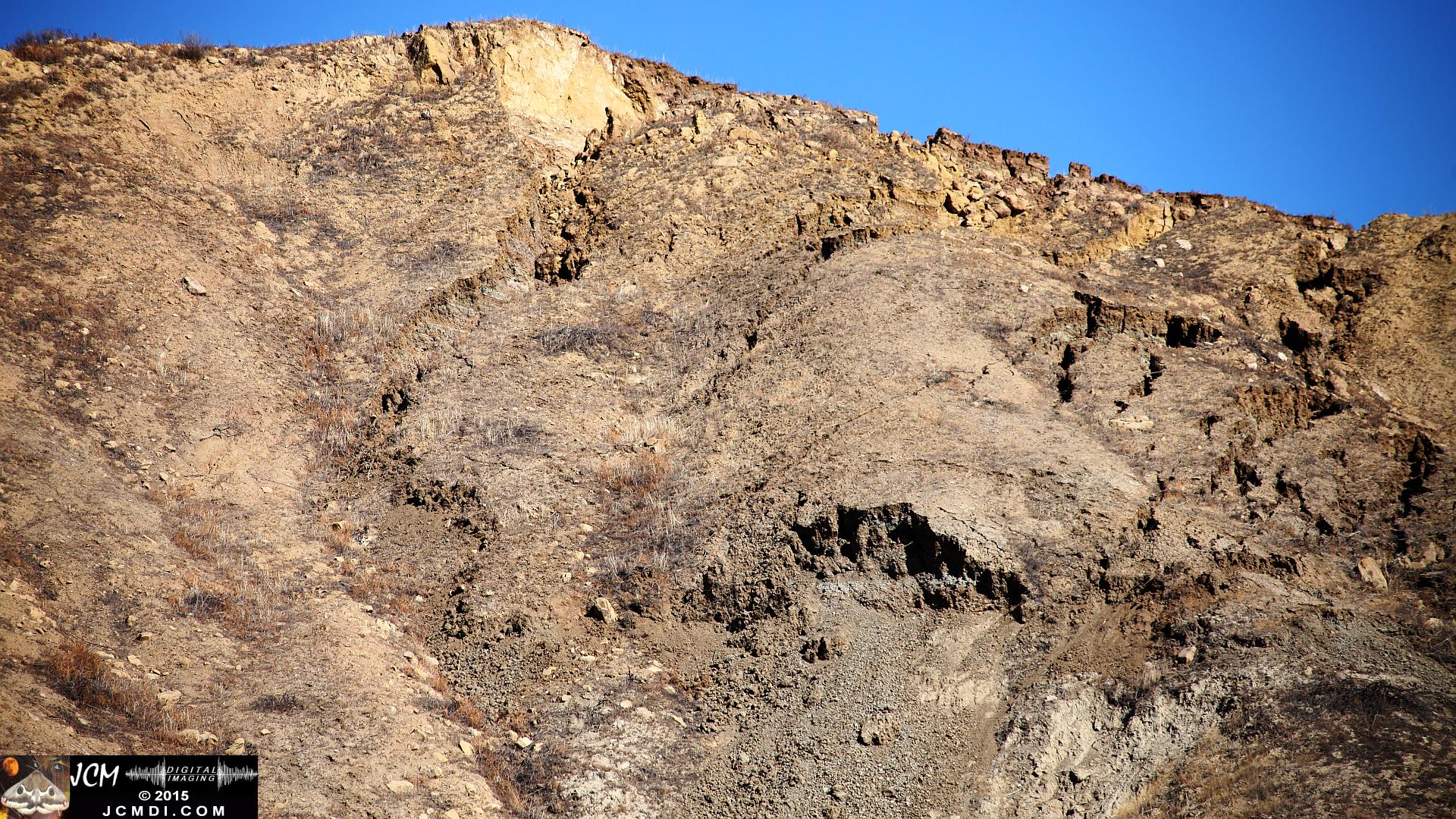 Landslide, buckled pavement, and terrain at Vasquez Canyon Road in Santa Clarita, CA filmed 11-25-2015